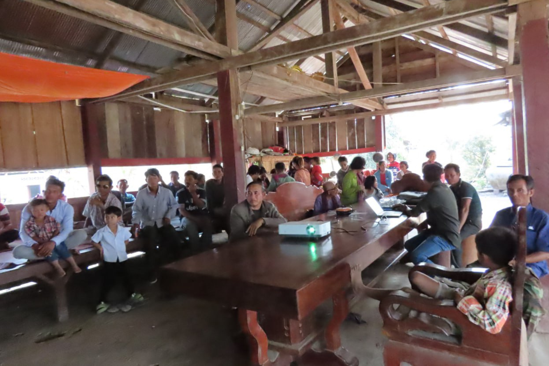 Community members attend a workshop on Sunda pangolins