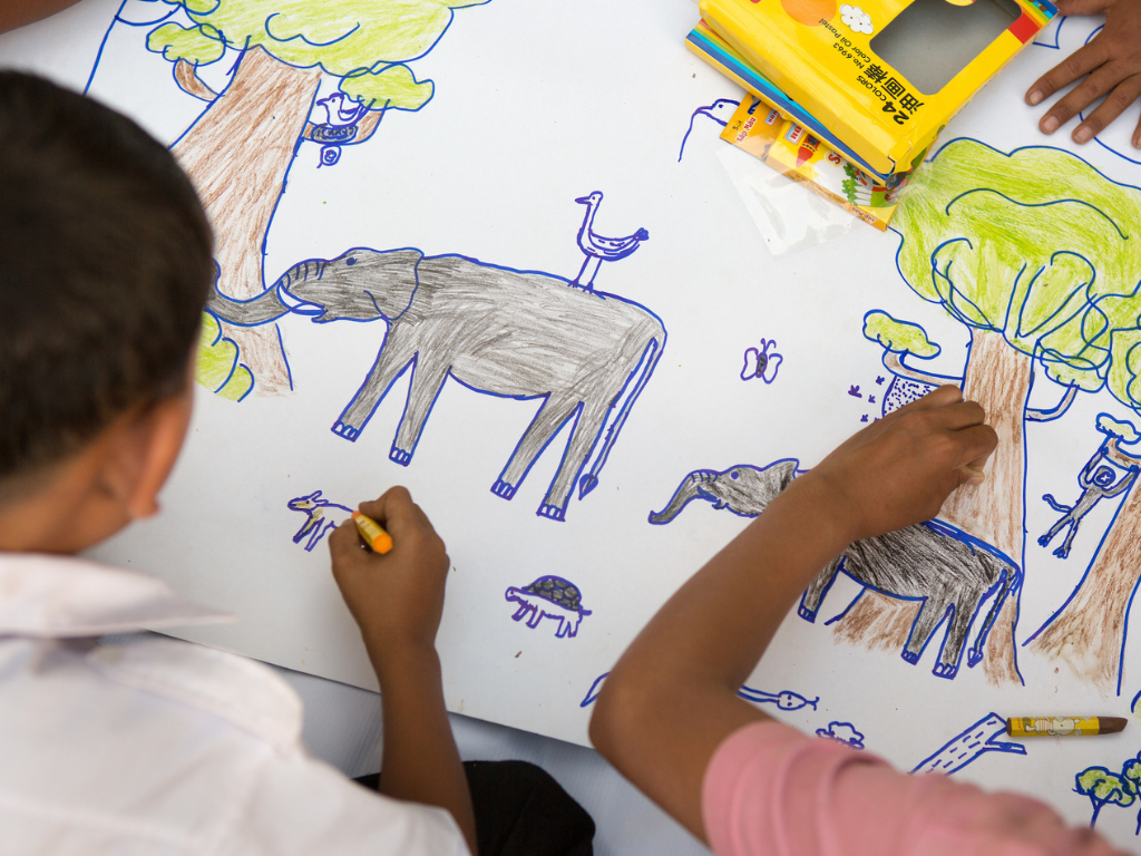 Cambodian youth draw elephants